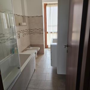 a bathroom with a sink and a toilet and a shower at B apartments LUXURY in Case Bruciate