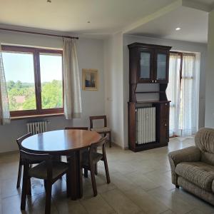 a living room with a table and a couch at B apartments LUXURY in Case Bruciate