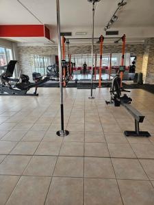 a gym with several treadmills and machines at B apartments LUXURY in Case Bruciate