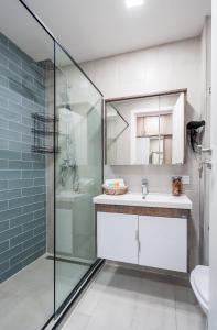 a bathroom with a glass shower and a sink at New Gudauri LOFT in Gudauri