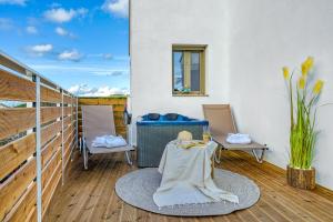 a balcony with a table and two chairs and a window at Luminoza Villa Zakynthos in Volímai +45 photos