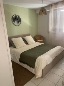 a bedroom with a large bed in a room at Le petit chalet in Luc-en-Diois