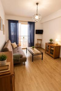 a living room with a couch and a table at Apt Puerto Burriana in Burriana