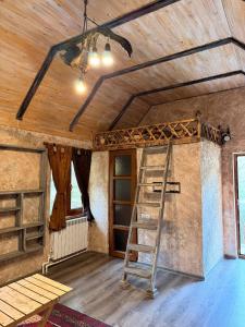 a ladder in the middle of a room with a ceiling at Dili Dzor in Dilijan +7 photos