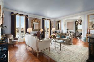 a living room with a couch and chairs at The St. Regis Florence in Florence