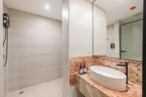 a bathroom with a sink and a mirror at Lilybeth Hotel Pratunam in Bangkok +124 photos