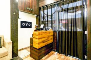 a entrance to a store with a large glass door at SPOT ON Hotel Shree Ji in Indore