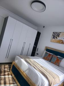 a bedroom with a bed with a large window at Haven 2 lustic in Nairobi