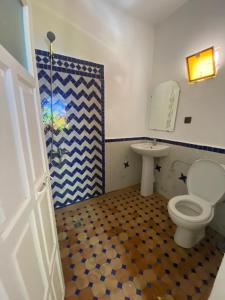 a bathroom with a toilet and a sink at Rif House MEDIOUNA in Tangier +19 photos