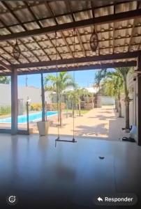 a room with a view of a pool at Casa 108 in Guaibim