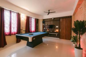a billiard room with a pool table in it at CueCasa in Guwahati