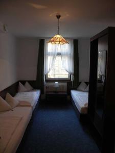 Ein Bett oder Betten in einem Zimmer der Unterkunft Hotel Pension Graf