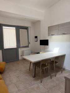 a kitchen with a table and chairs in a room at Casina Toscana in Certaldo