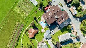 an overhead view of a farm with a group of buildings at Berghof-Chalet in Erpfendorf +31 photos