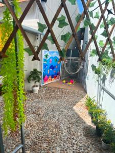 a garden with a patio with plants and a fence at Cát Home in Phú Hiệp