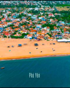 an aerial view of a beach with colorful buildings at Cát Home in Phú Hiệp