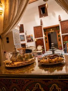 two plates of food on a counter in a room at Riad Hamad Tijani in Fez