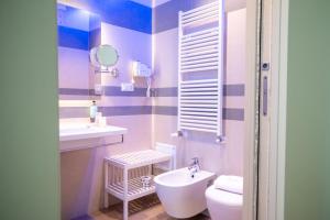 a bathroom with a sink and a toilet at Hotel Cicò in Torre Santa Sabina