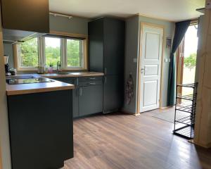a kitchen with a sink and a counter top at Villa Ragunda in Hammarstrand