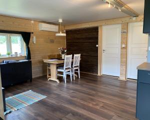 a room with a table and chairs and a door at Villa Ragunda in Hammarstrand +41 photos