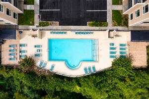 an overhead view of a building with a swimming pool at Chic Nashville Retreat, River Views and VIP Vibes in Nashville