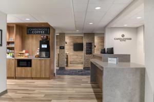 a lobby of a coffee shop with a counter at Candlewood Suites Oak Harbor by IHG in Oak Harbor