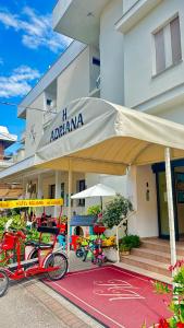 two bikes parked in front of a building at Hotel Adriana in Bellaria-Igea Marina