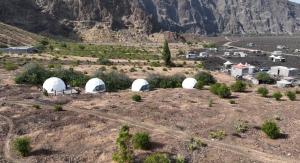 an aerial view of tents on a mountain at Sodade Eco Camp in Portela