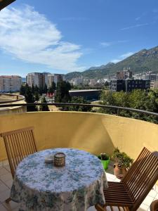 a table and chairs on a balcony with a view at Sweet dreams apartment in Bar