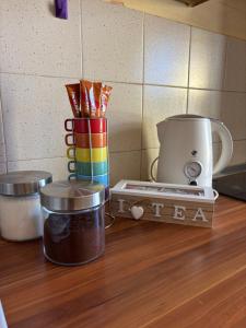 a counter top with a coffee maker and a blender at Sweet dreams apartment in Bar +13 photos