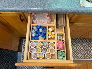 a drawer in a kitchen with different types of food at Honey Ridge Forest Retreat in South Bloomingville
