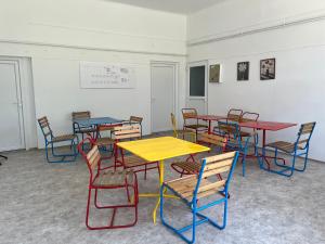 a classroom with colorful tables and chairs at Gedeon Garden in Budakalász
