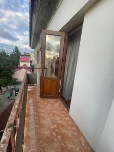 a door on the side of a building with a balcony at Poti apartment in Poti +6 photos
