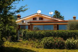 a house with a solarium on top of it at The Lake Escape - Trevignano in Trevignano Romano