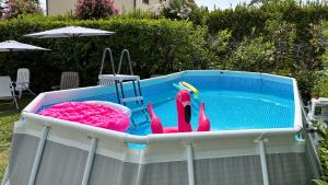 a pool of water with some toys in it at Villa Felicità in Lucca