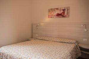 Posteľ alebo postele v izbe v ubytovaní Hotel Bue Marino