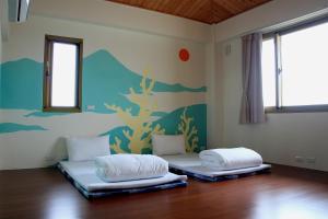 Postel nebo postele na pokoji v ubytování 雲庭民宿 Yunting B&B