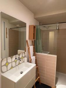 a bathroom with a sink and a shower at The Secret Lakeside in Gravedona