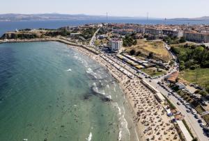 an aerial view of a beach with a crowd of people at Go to Sleep in Gelibolu