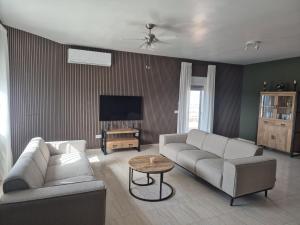 a living room with a couch and a table at Casa Castillo in Huércal-Overa