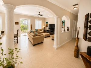 a living room with a couch and a table at The Garden, Miami Lakes in Miami Lakes