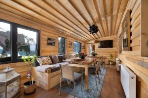 a living room with a couch and a table at Wellness-Beskydy in Prostřední Bečva