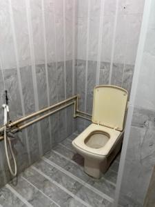a bathroom with a toilet in a stall at Lara Homestay duplex 1bhk in Secunderabad