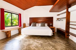 a bedroom with a bed and a window at Casa Swell Coronado, Adults-Only Boutique Hotel, Pool & Beach in Playa Coronado