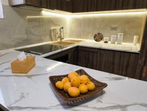 a bowl of oranges on a counter in a kitchen at T'teni in Urtsʼadzor +25 photos