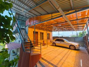 a car parked inside of a house with a garage at T'teni in Urtsʼadzor