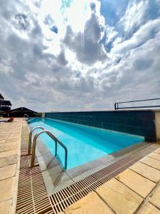 a swimming pool on the roof of a building at Unique one bedroom with pool in Nairobi