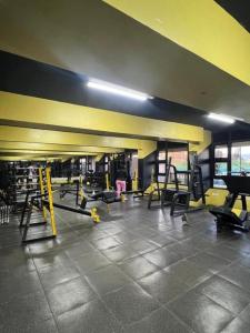 a gym with several treadmills and machines in it at Unique one bedroom with pool in Nairobi