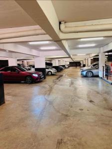an empty parking garage with cars parked in it at Unique one bedroom with pool in Nairobi