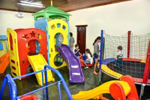 a group of children playing in a playground at Hotel e Restaurante Sabor de Minas in Salinas